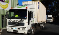 Tilt tray truck for moving removal shipping containers